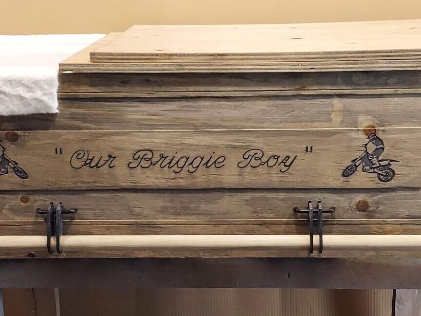 Rustic old west wooden casket with CNC custom engraving detail, personalized message. Budget-friendly, affordable and elegant