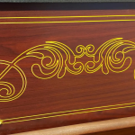 Detailed gold engraving on casket