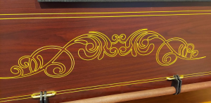 Detailed gold engraving on casket