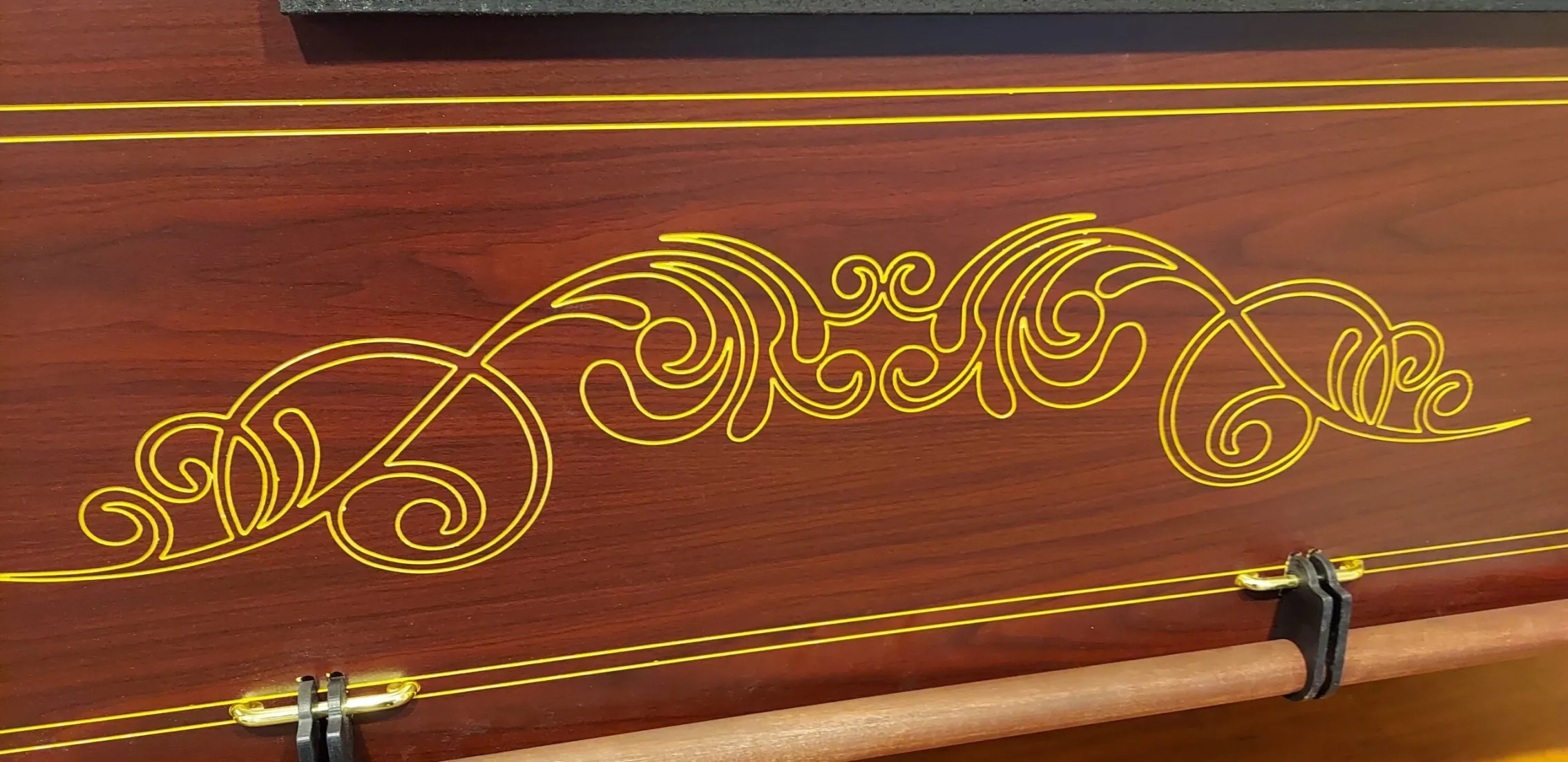 Detailed gold engraving on casket